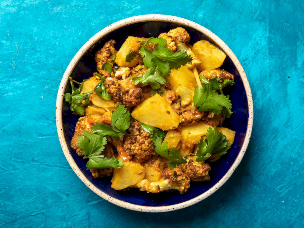 Aloo Gobi is best enjoyed with roti, naan, or rice. It can also be served as a side dish alongside other curries and dal